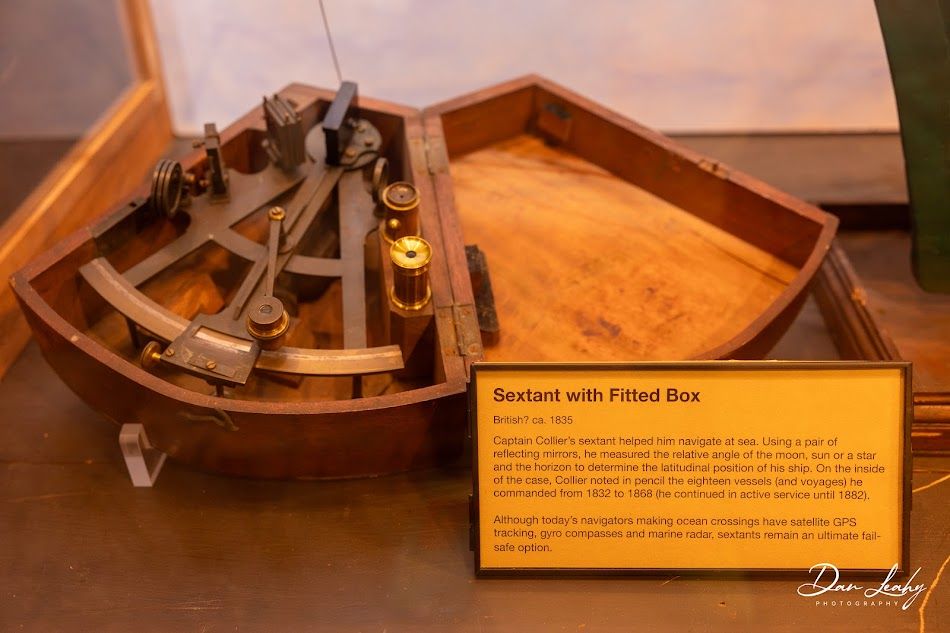 Captain Collier's sextant that helped him navigate the sea. Today's navigatators use GPS.