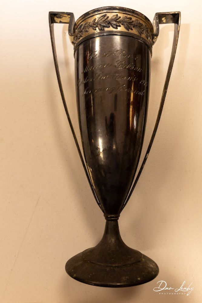 Woods was a record-breaking, long distance swimmer. She won this swimming trophy.