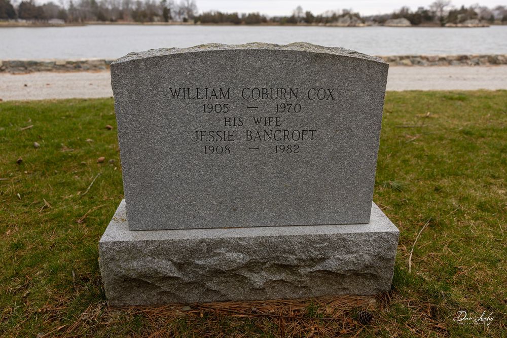 Backside of headstone for Cox and Cook with water view.