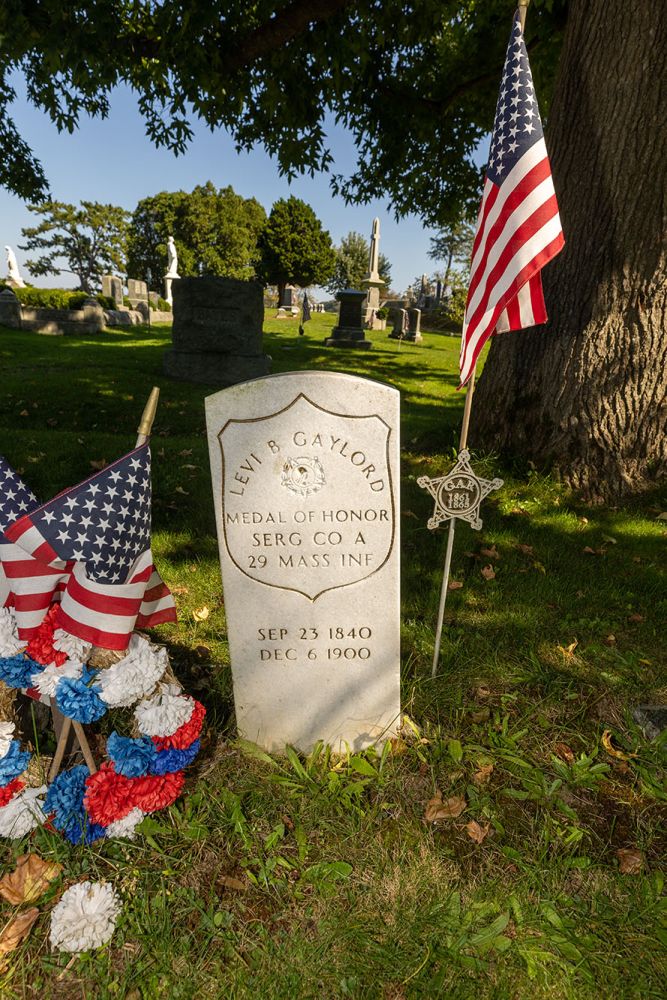 After a strong cleaning, Levi B Gaylord's military monument with gold leaf trim sparkles in the sun.