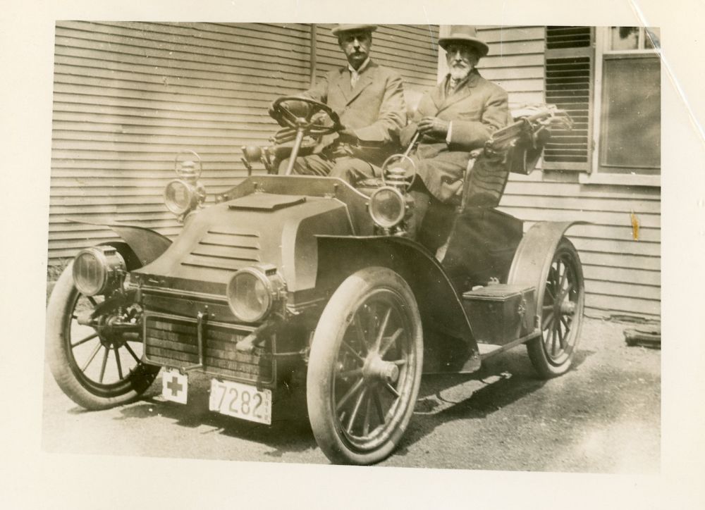 In his later years, Dr. Oliver Howe (right) was often driven in a car to see his patients.