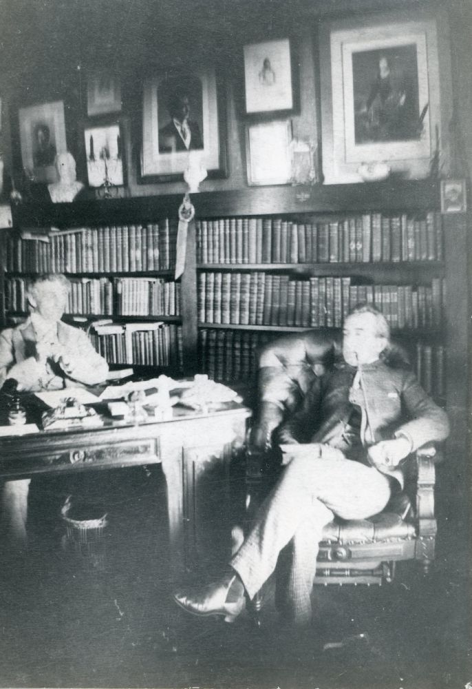 Barrett sits in his Margin Street study with legendary 19th century American stage actor Edwin Booth.