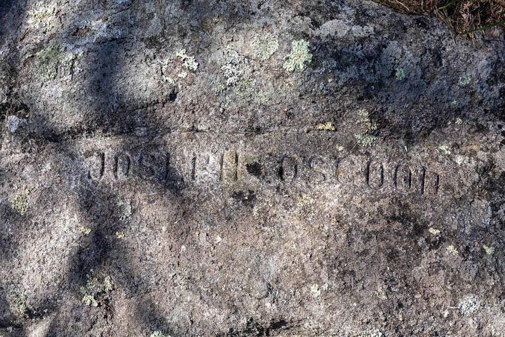 Joseph Osgood carved into plot boulder