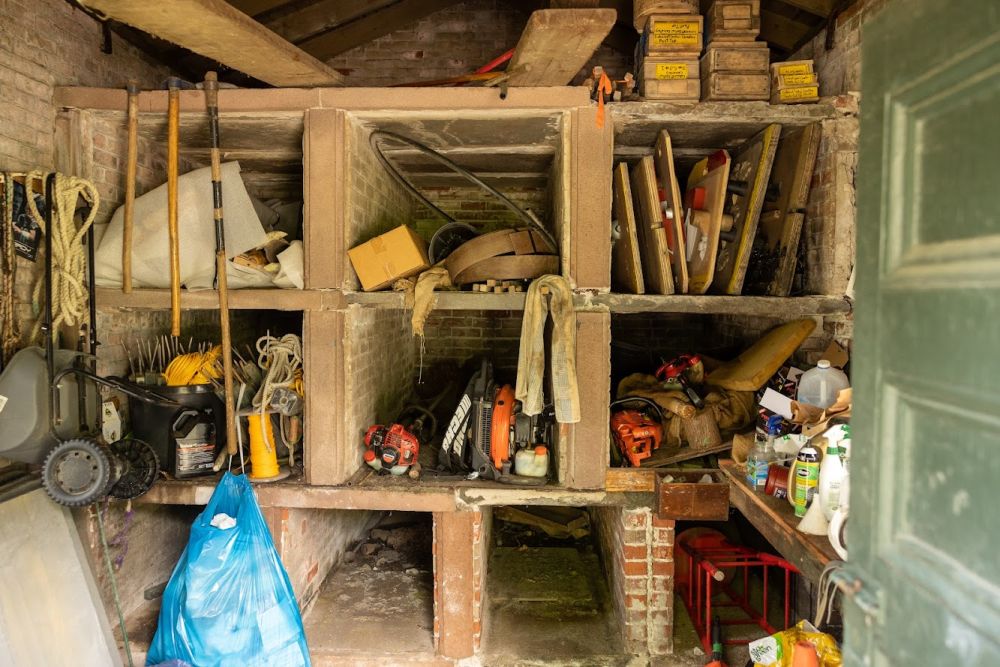 Interior of shed that now holds cemetery maintenance supplies